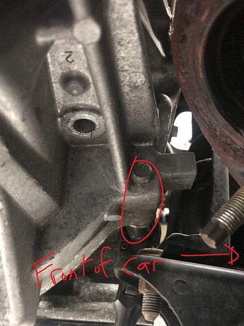 Hidden upper oil pan bolt