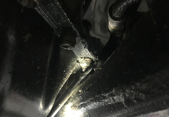 Removing lower oil pan fasteners